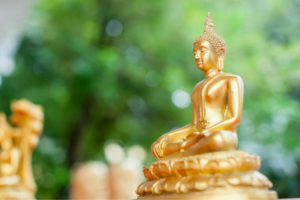 Gold meditation statue in garden